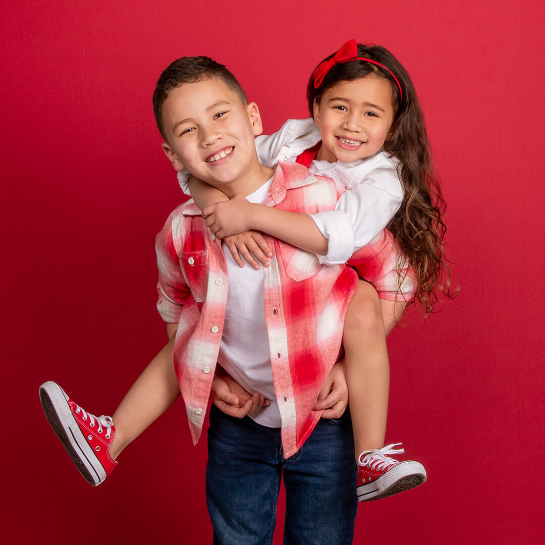 Sibling imagery with Valentine's Day photography theme captured at a JCPenney Portraits photography session.