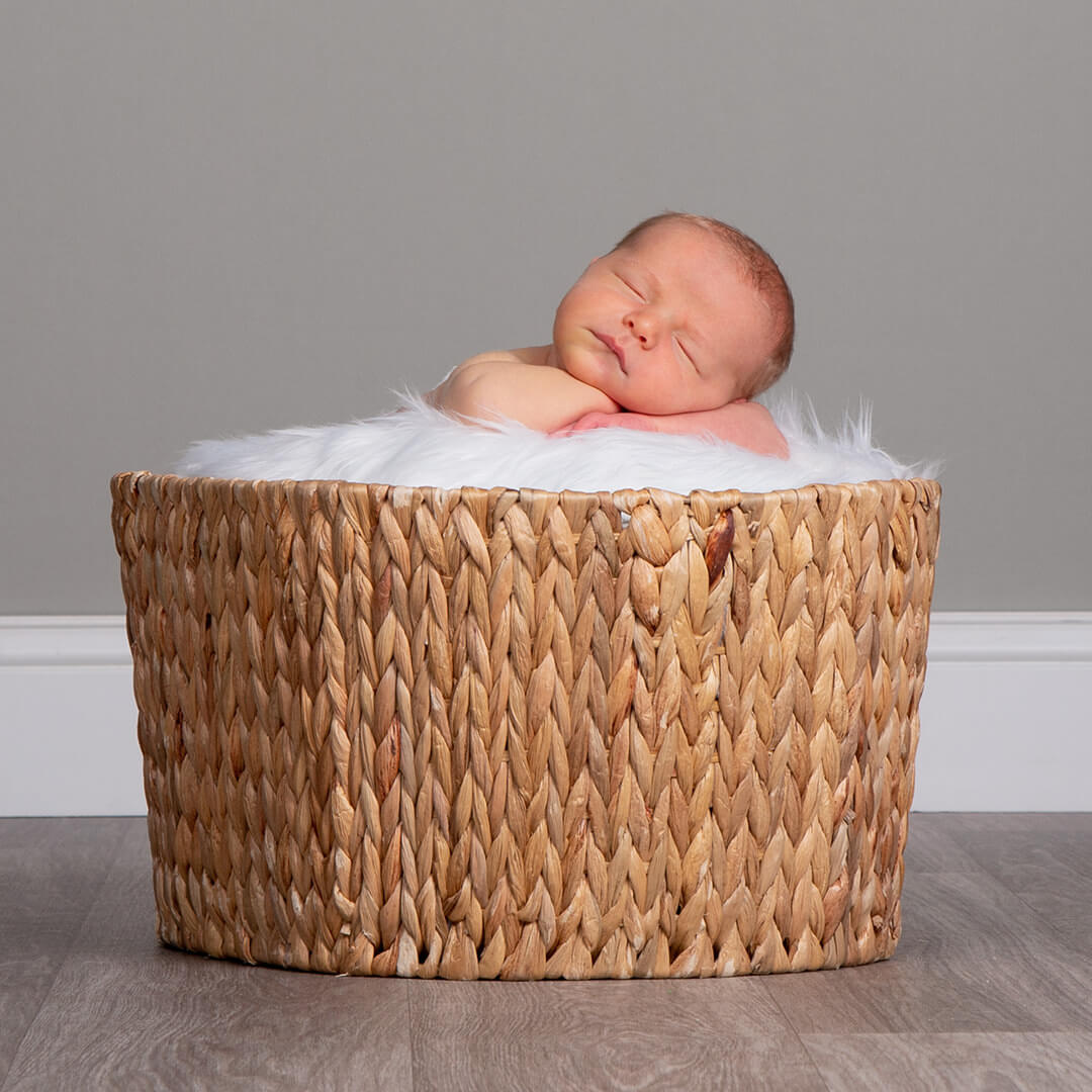 Newborn photography featuring our new baskets and blankets.