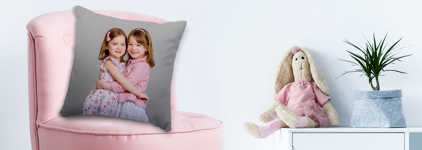 Photo pillow used as home decor featuring pictures captured at JCPenney Portraits.