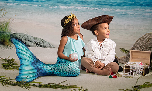Children photographed on our Mermaids & Pirates background