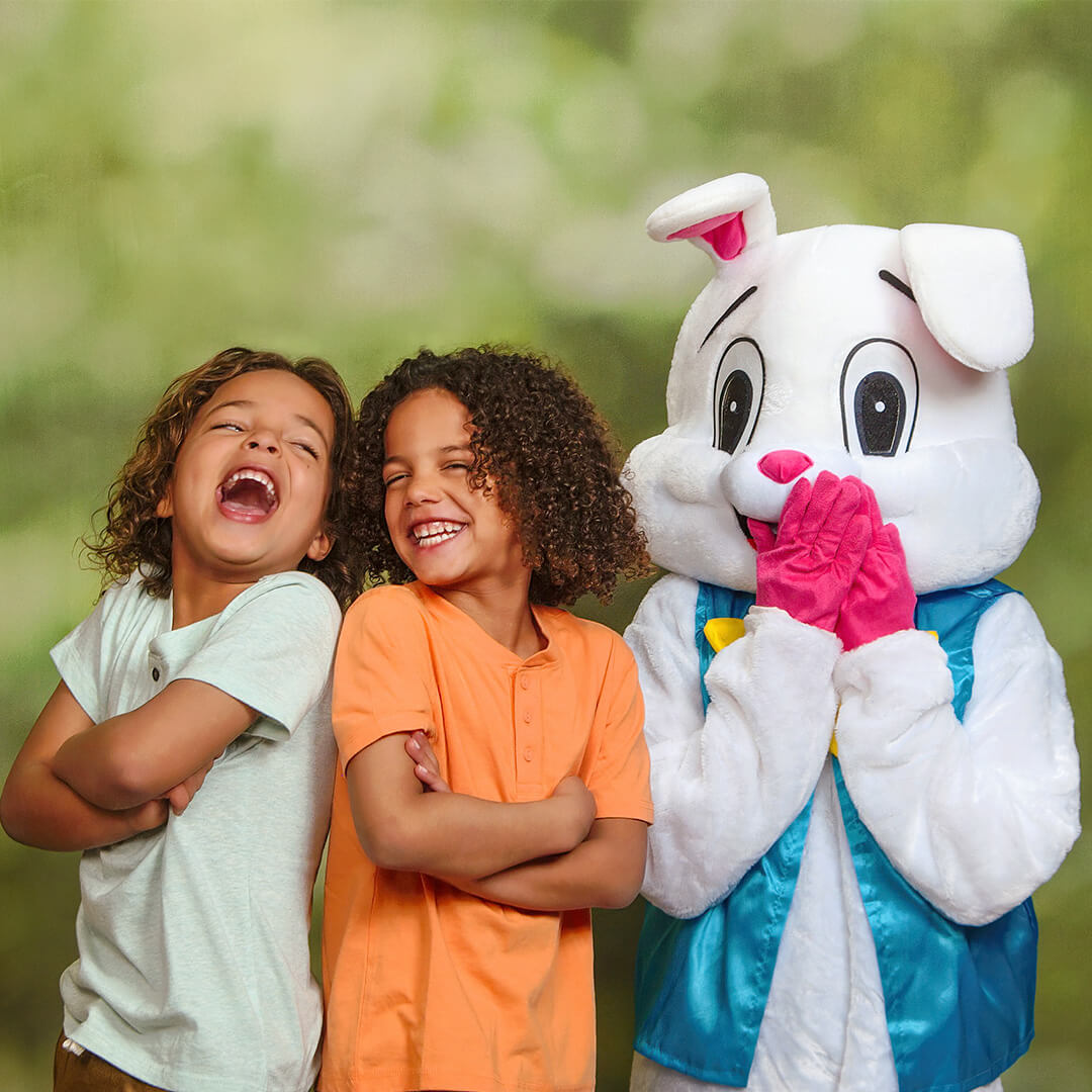 Easter photo of twin boys posing with Easter Bunny.