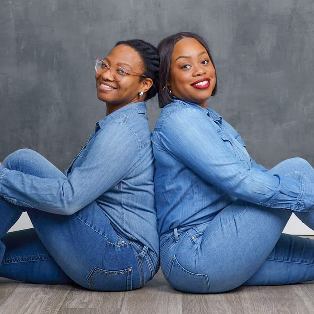 Two women in denim outfits posing for best friend photos