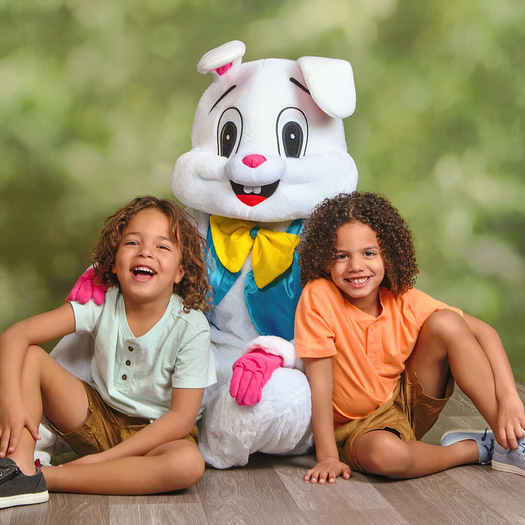 Easter photo of twin boys posing with Easter Bunny