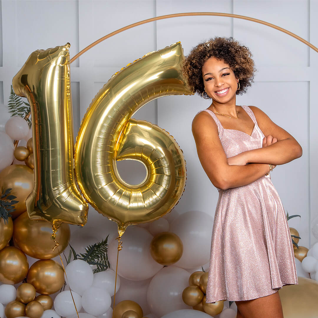 Girl posing for sweet sixteen birthday photoshoot at JCPenney Portraits.
