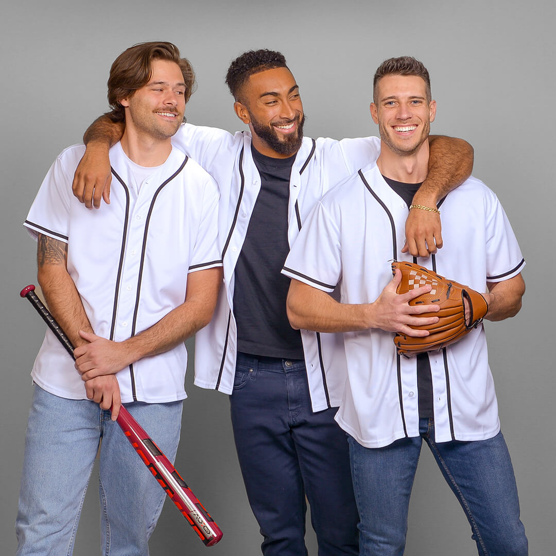 Three male best friends dressed in baseball uniforms for a best friends photoshoot