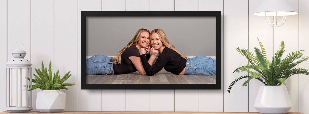 Framed print on a wall showcasing bestie photography